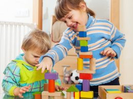 siblings-together-playing-with-toys_1398-3964